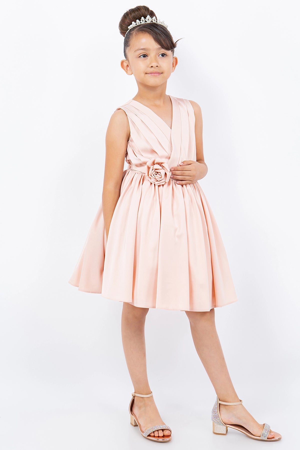 Accented diagonal bodice pleats adds character to this Blush kids party dress.