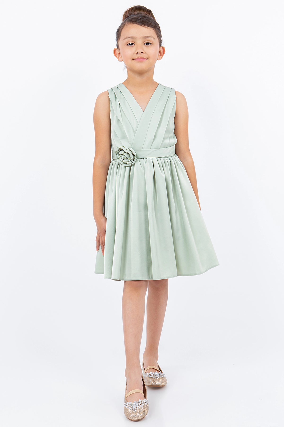 Showcasing with a rosette at the waist, this Sage kids party dress displays elegant detail.