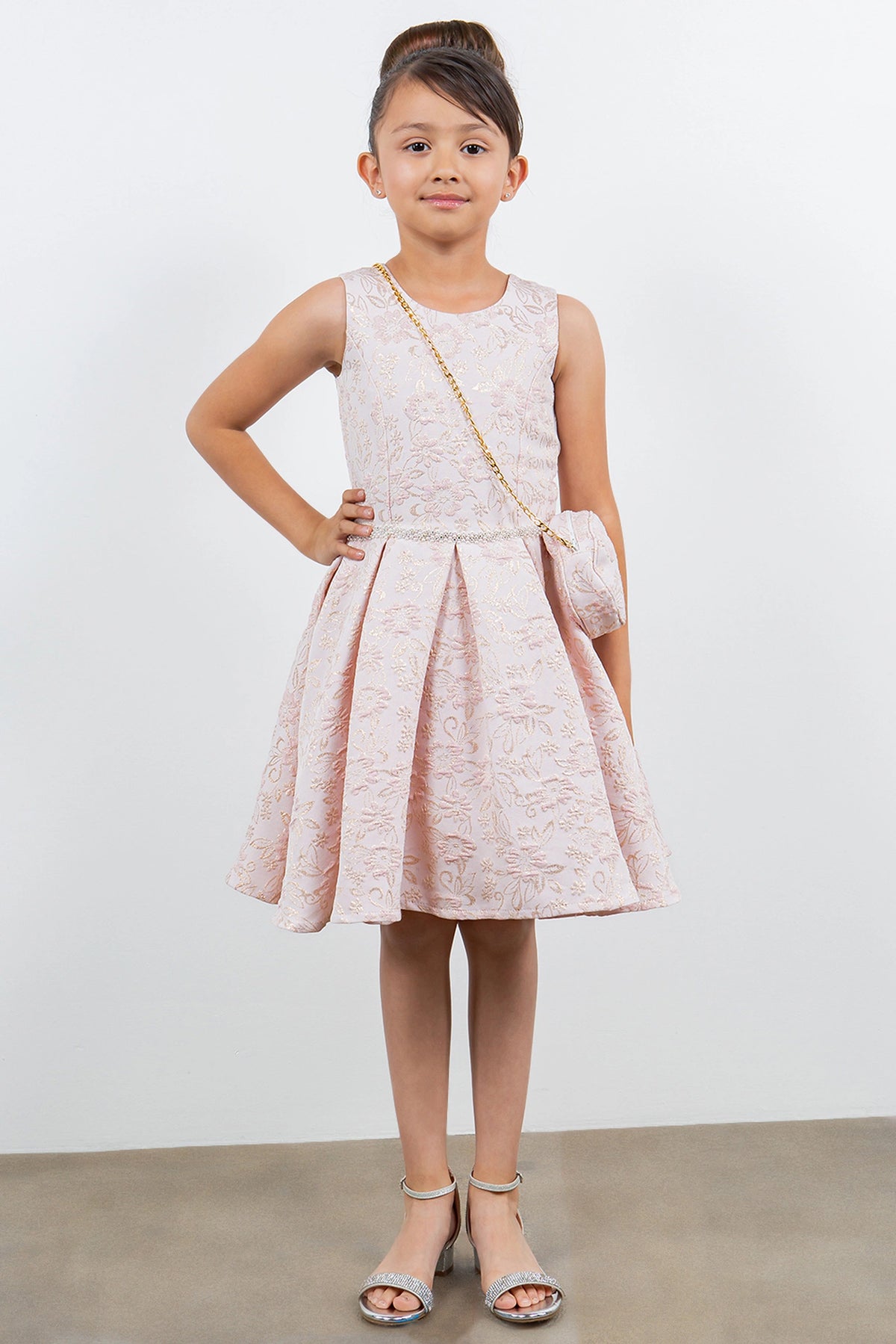 Showcasing with floral jacquard texture, this Pink kids party dress displays elegant detail.