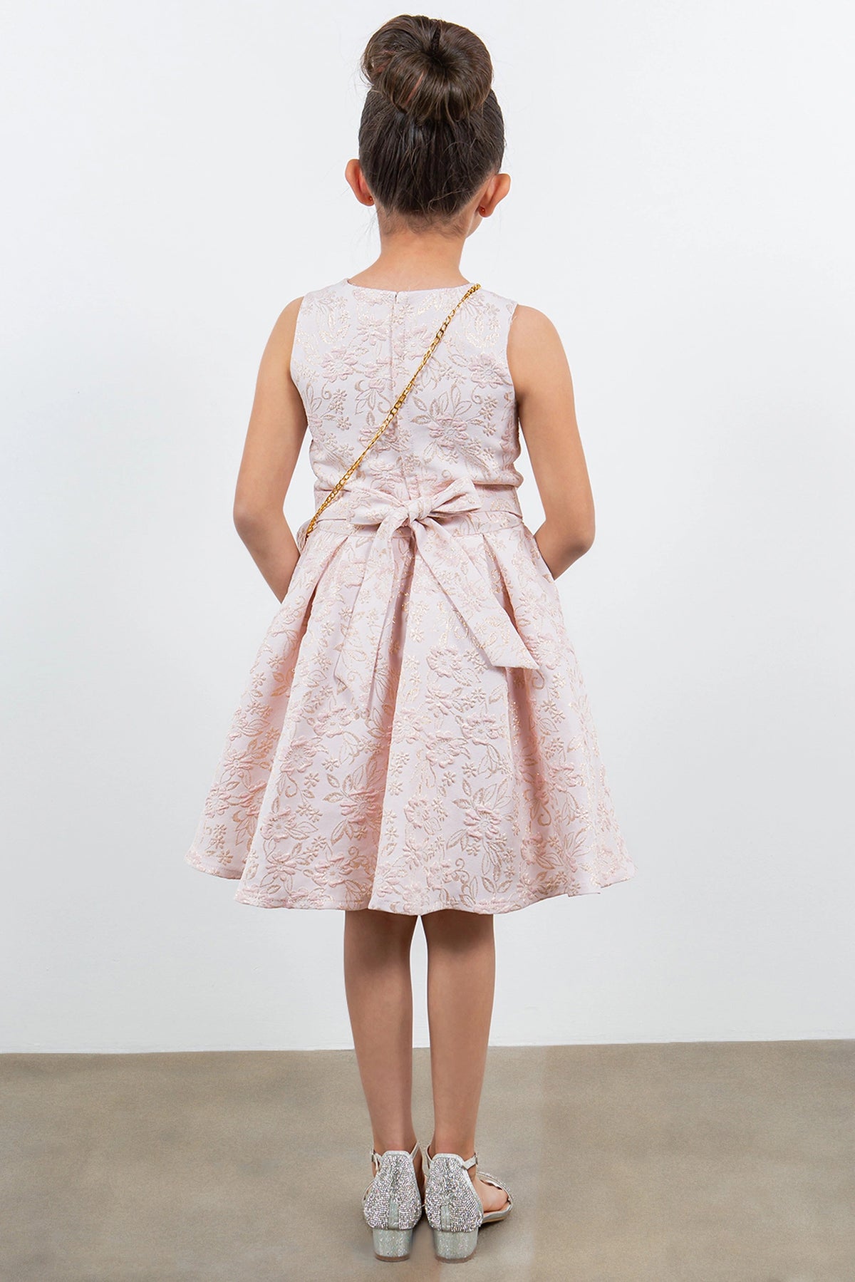 Finished details of a satin waist bow distinguish the Pink kids party dress.