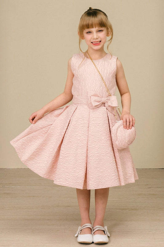 Showcasing with a large front waist bow, this Pink kids party dress displays elegant detail.