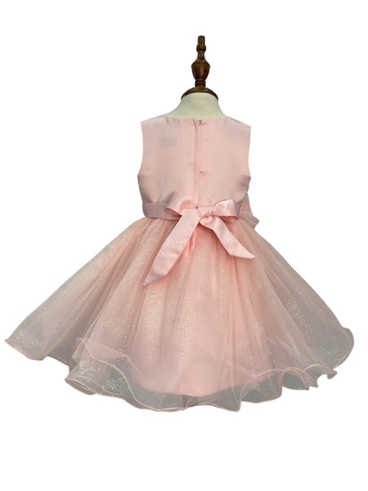 Blush dress back view highlighting full skirt and elegant silhouette
