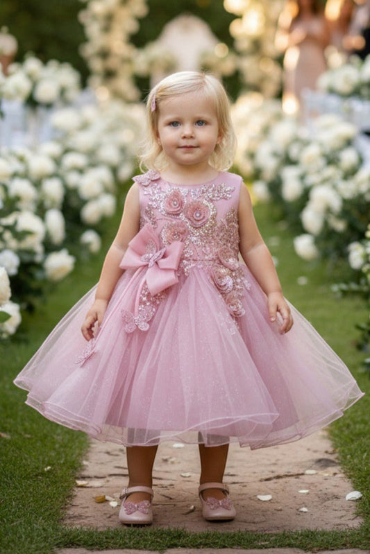 Kid Wearing Dusty Rose Flower Girl Dress Front View With Layered Skirt And Oversized Bow Detail