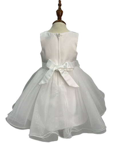 White dress back view highlighting full skirt and elegant silhouette