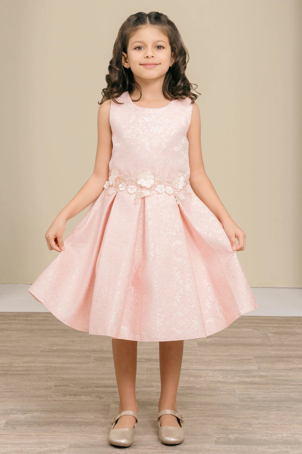 Accented a softly pleated skirt adds character to this Pink kids party dress.
