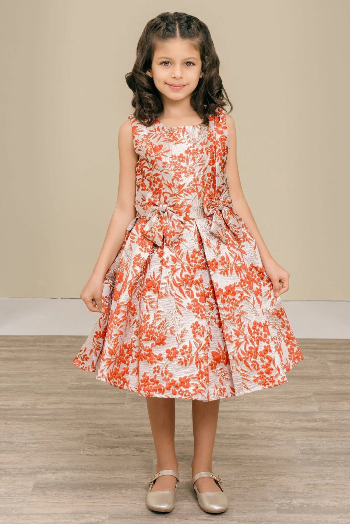 Showcasing with contrasting floral jacquard motifs, this Burgundy kids party dress displays elegant detail.