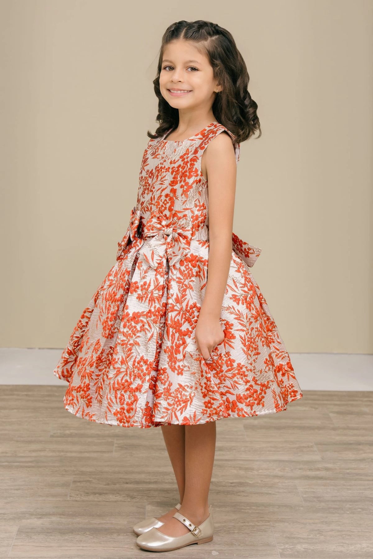 Accented a pleated full skirt adds character to this Burgundy kids party dress.