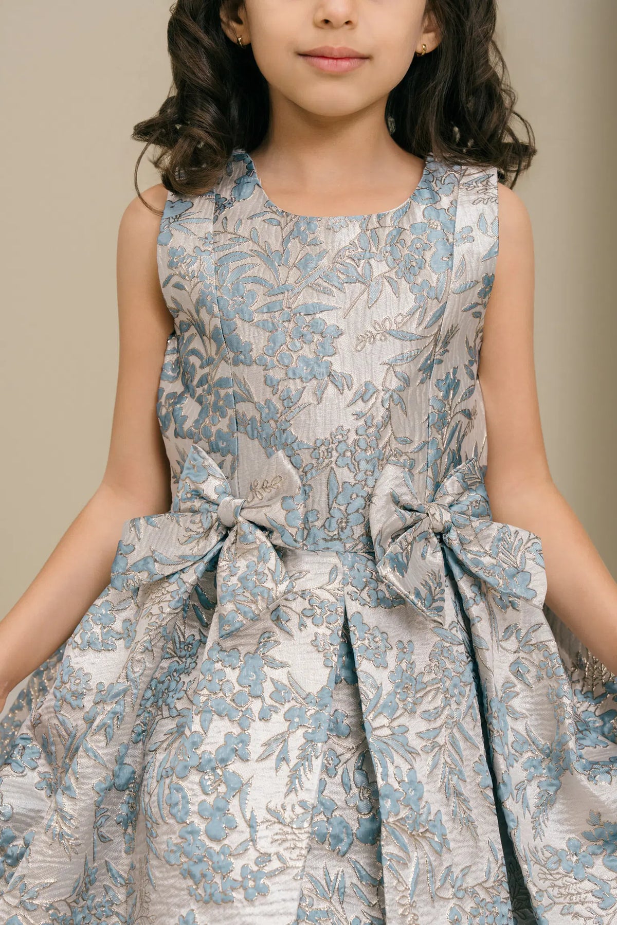 Accented contrasting floral jacquard motifs adds character to this Dusty Blue kids party dress.