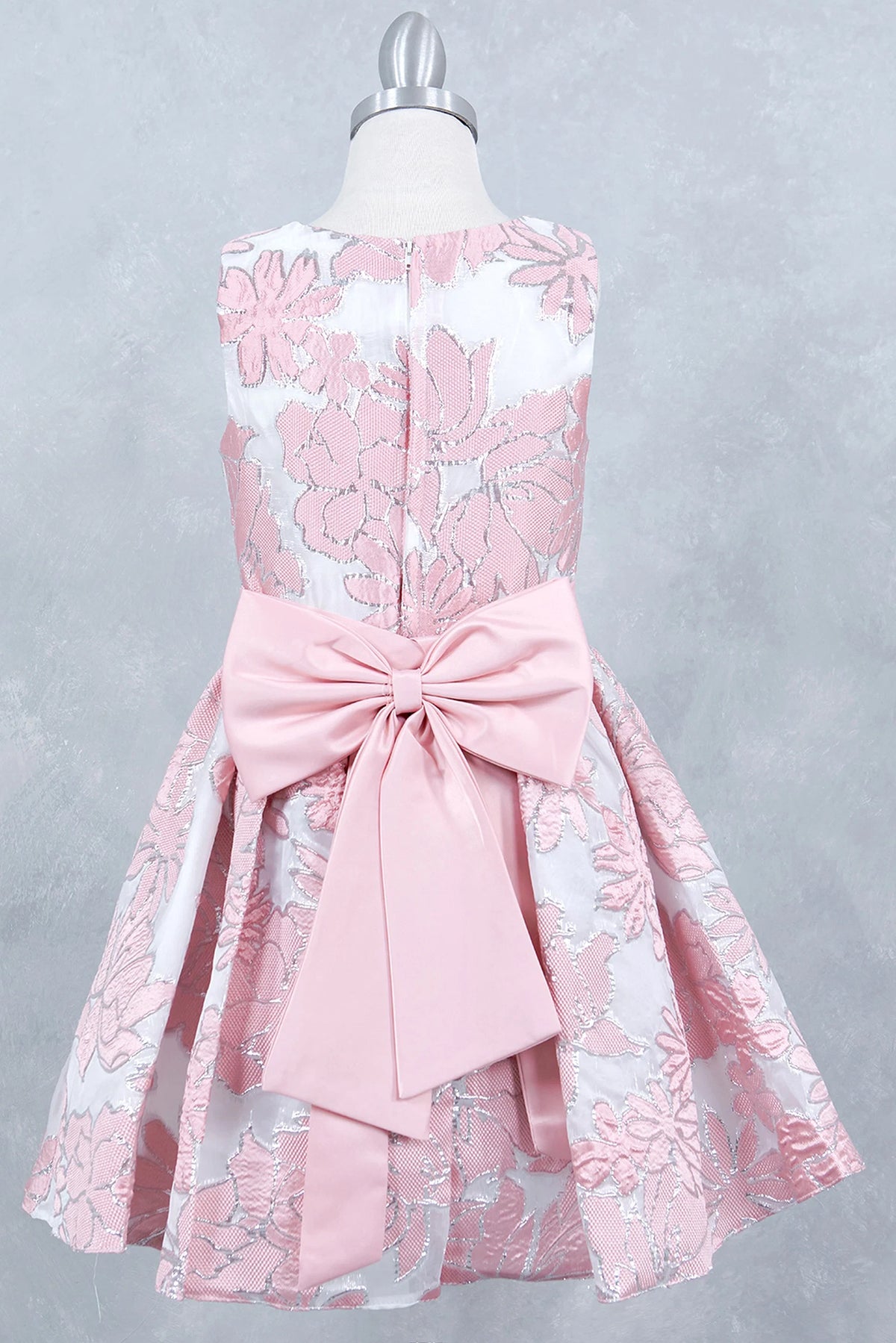 Finished details of a large satin bow distinguish the Pink kids party dress.