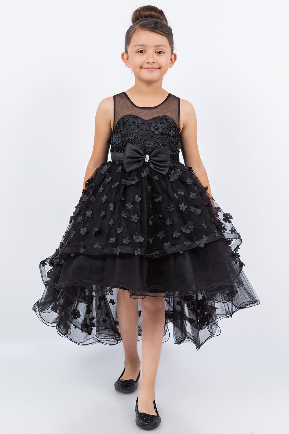 Black flower girl dress front view with illusion bodice and hi-low 3D flower skirt.