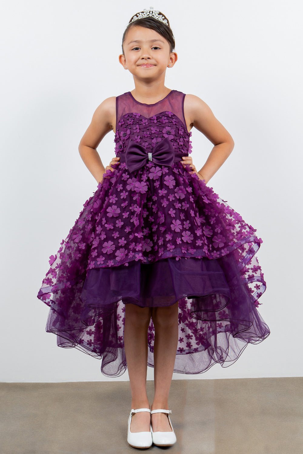 Purple flower girl dress front view with illusion bodice and hi-low 3D flower skirt.