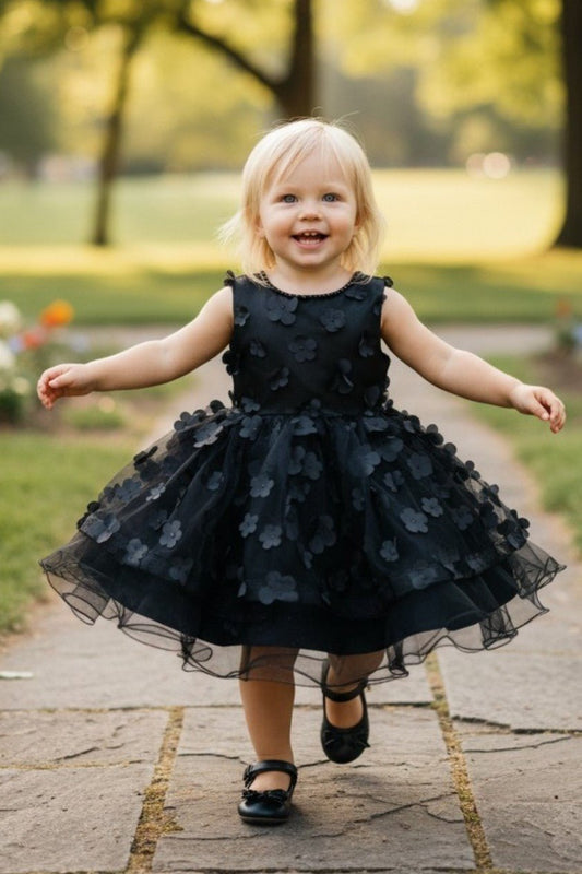 Kid Wearing Black Flower Girl Dress Front View With Off Shoulder Neckline And Bow Waist