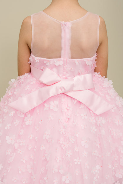Close-up back view of pink dress showing 3D floral detail and bodice texture