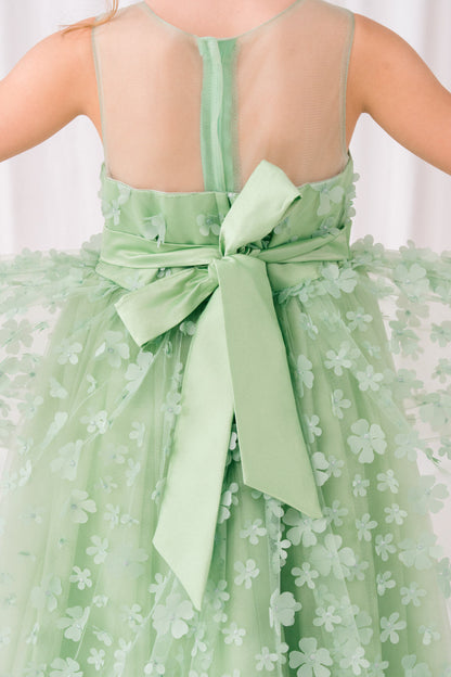Sage dress side view highlighting hi-low silhouette and elegant structure