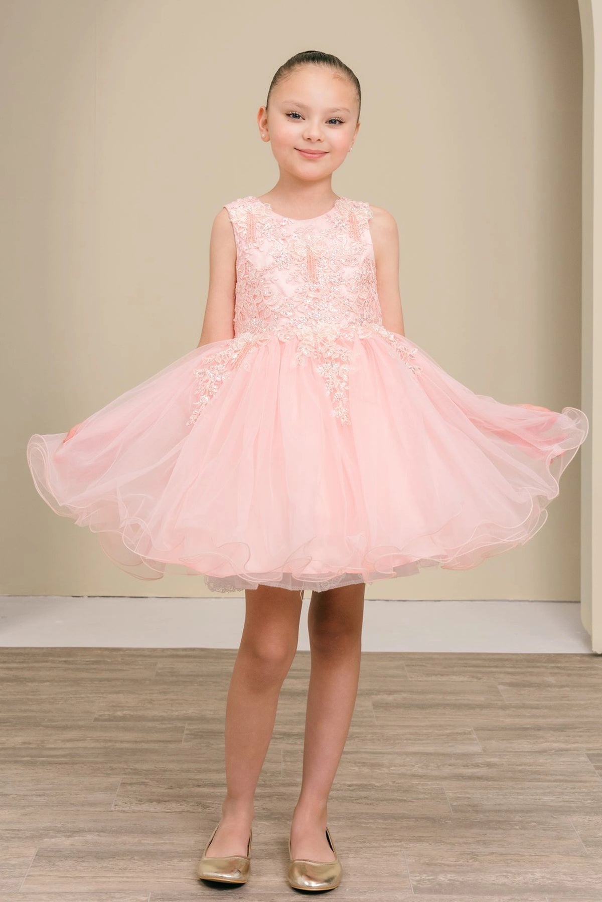 Accented a full tulle skirt adds character to this Blush kids party dress.