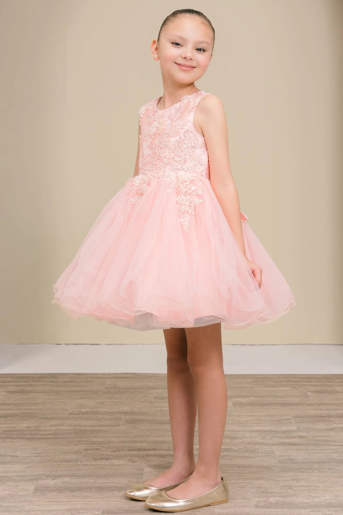 Featuring with floral lace across the bodice, this Blush kids party dress displays elegant detail.