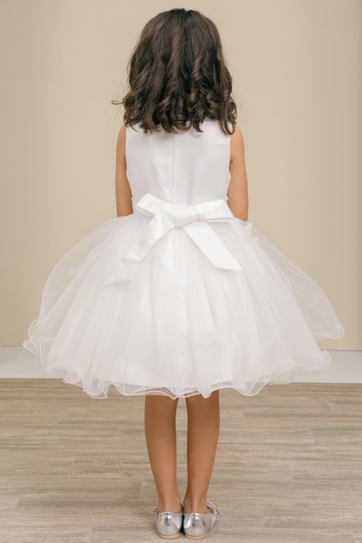 Finished details of a satin waist bow distinguish the Off-White kids party dress.