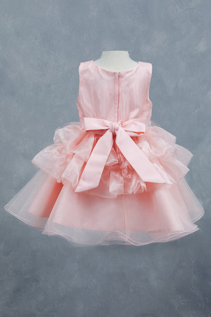 Peach dress back view highlighting layered tulle and soft silhouette
