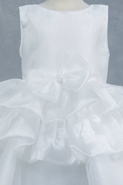 Close-up front view of white dress showing floral embellishment and satin waistband