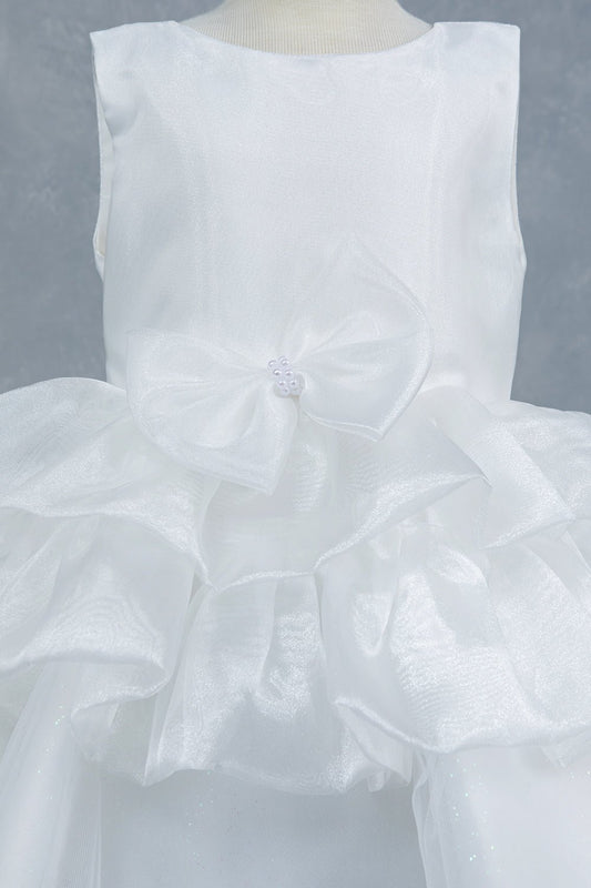 Close-up front view of white dress showing floral embellishment and satin waistband