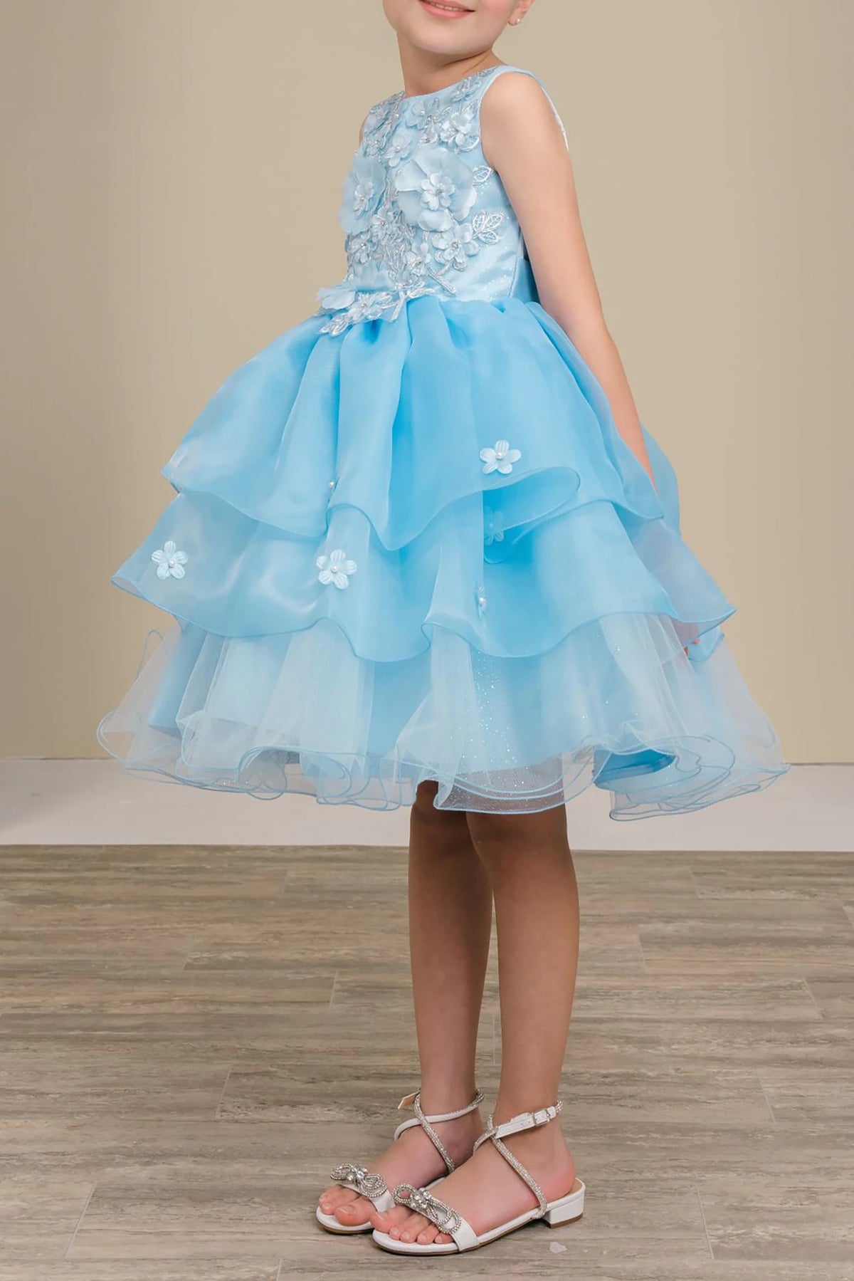 Light blue flower girl dress with floral details.