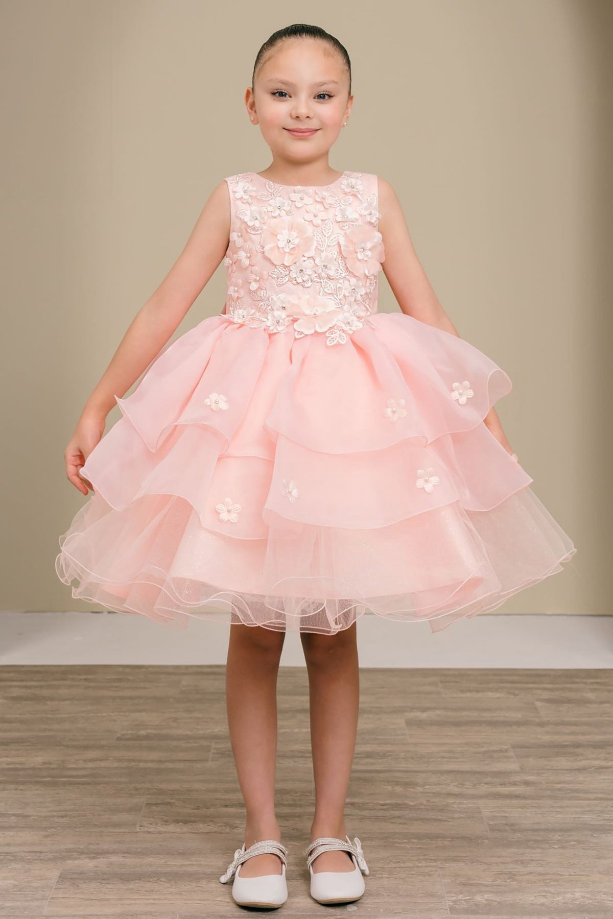 A peach blush floral flower girl dress.