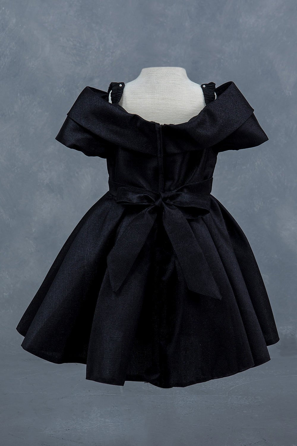 Black dress back view highlighting elegant fit and classic silhouette