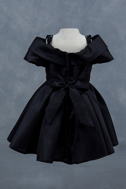 Black dress back view highlighting elegant fit and classic silhouette