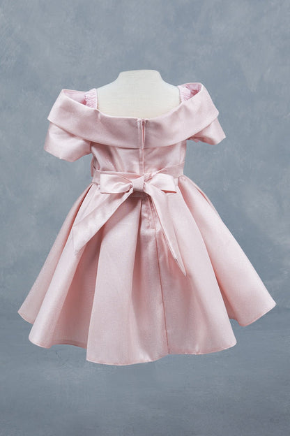 Blush dress back view highlighting elegant fit and classic silhouette