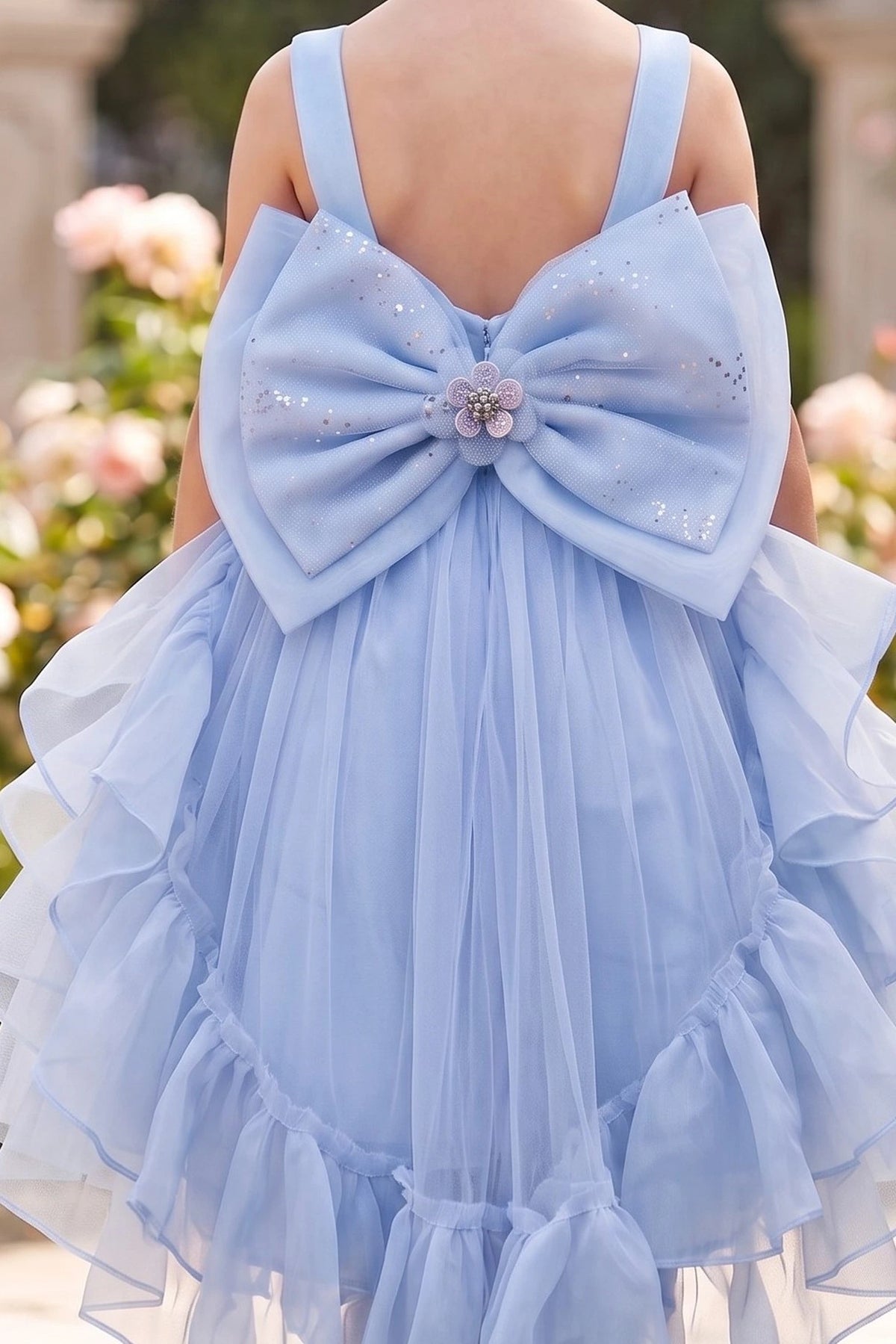 Featuring jeweled center on the oversized back bow on the Blue flower girl dress.