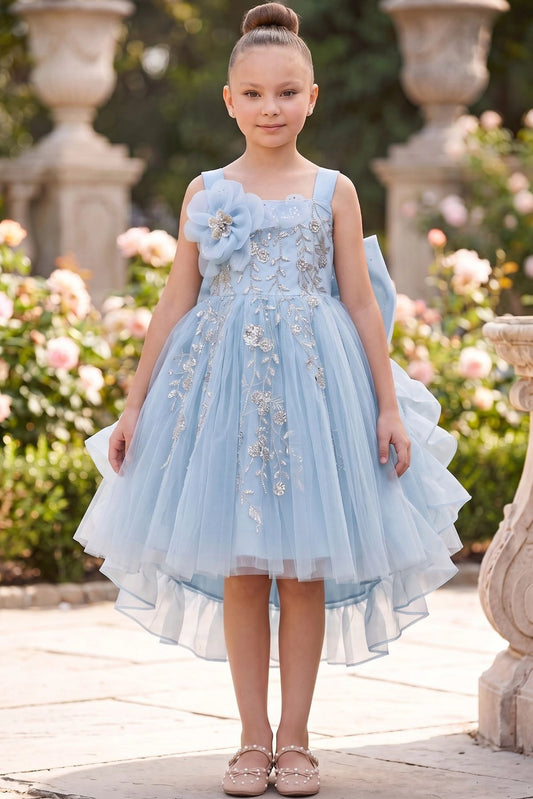 Blue flower girl dress features floral embroidery above the ruffled hem.