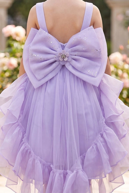 A Lilac flower girl dress showing oversized satin bow above ruffled tulle.
