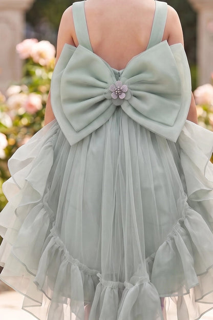 Featuring jeweled center on the large satin bow on the Sage flower girl dress.