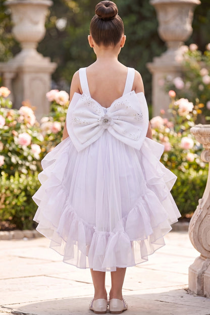 A White flower girl dress showing large satin back bow with beaded center.