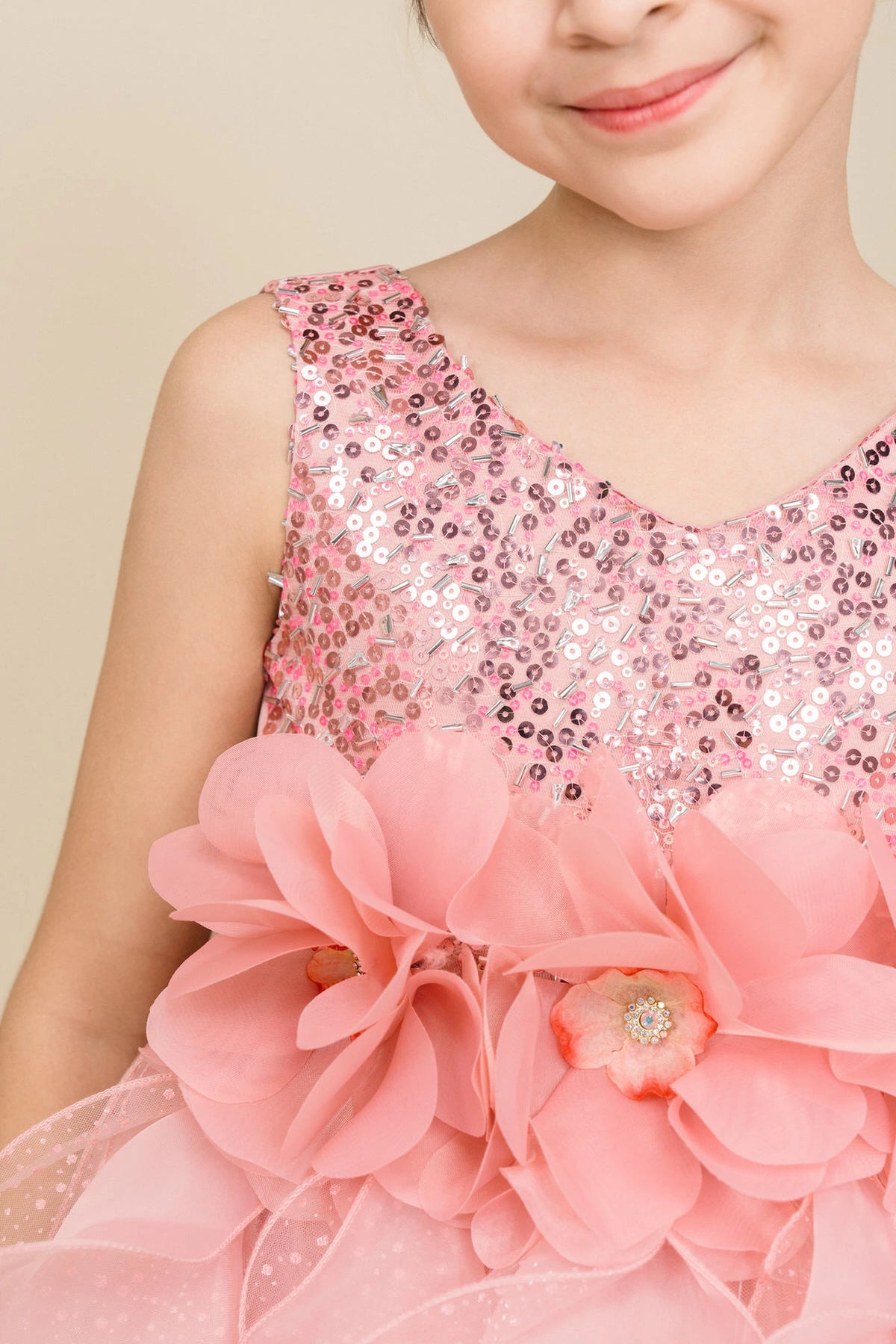 Accented petal-shaped skirt ruffles adds character to this Rose kids party dress.