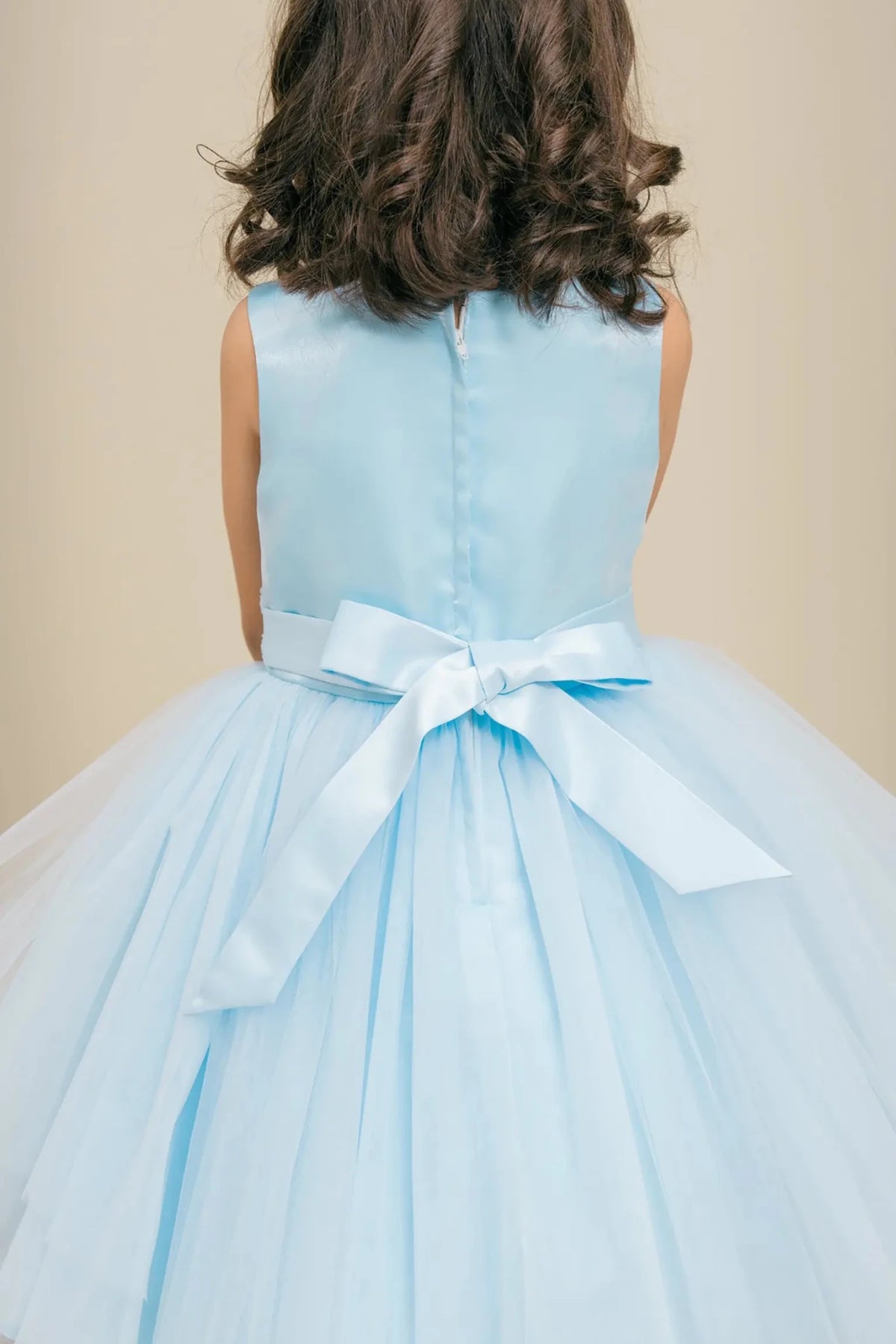 Ligh blue flower girl dress with satin bodice, satin bow back, and layered tulle skirt.