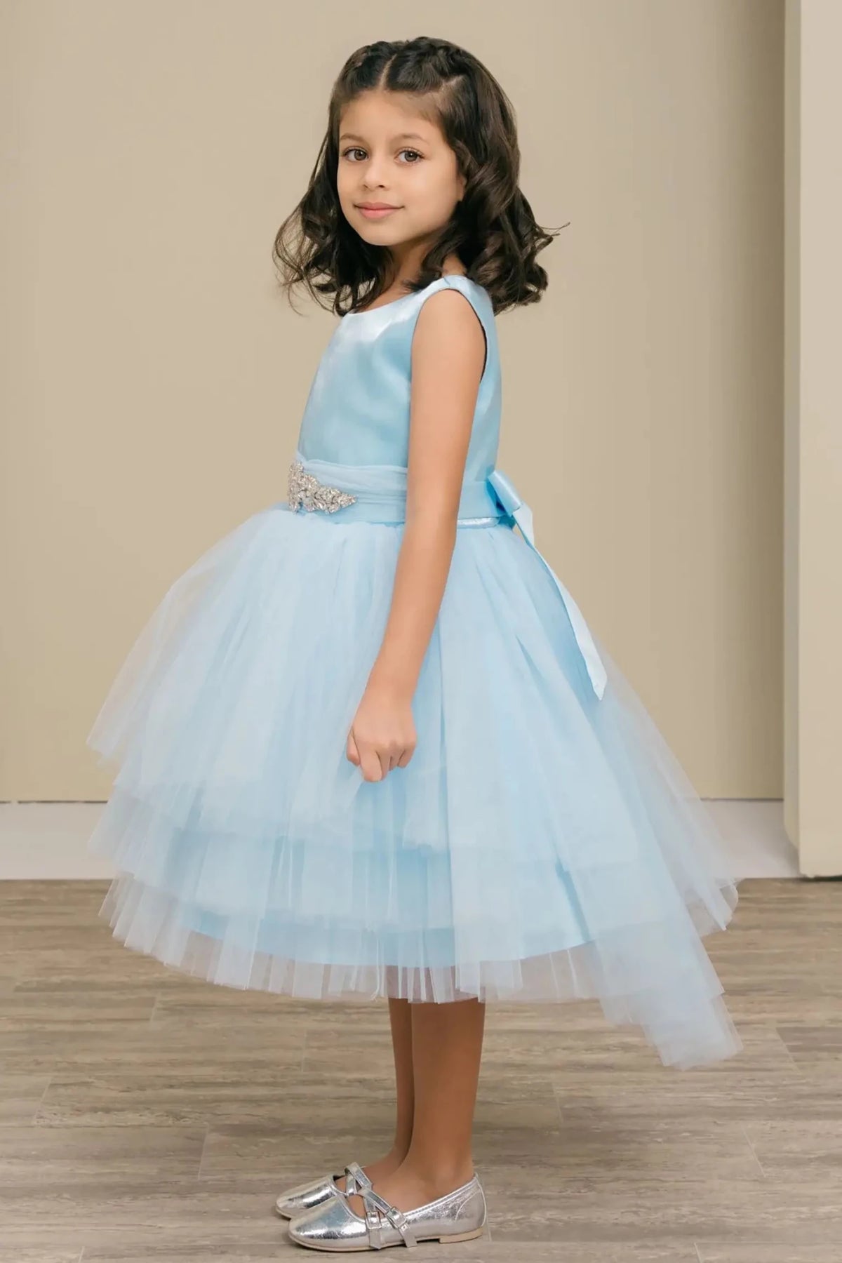Ligh blue flower girl dress with satin bodice, rhinestone waistband, satin bow back, and layered tulle skirt.