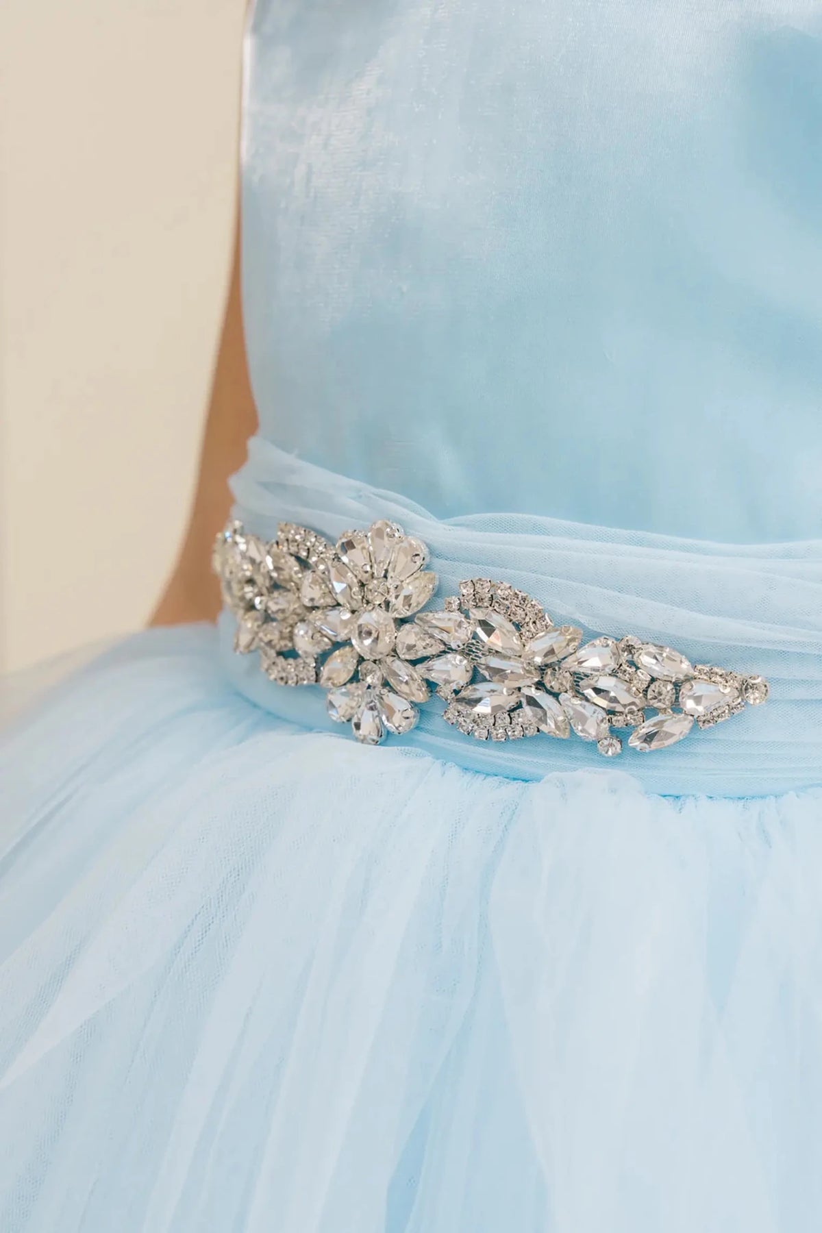 Ligh blue flower girl dress with rhinestone waistband detail and satin bodice.