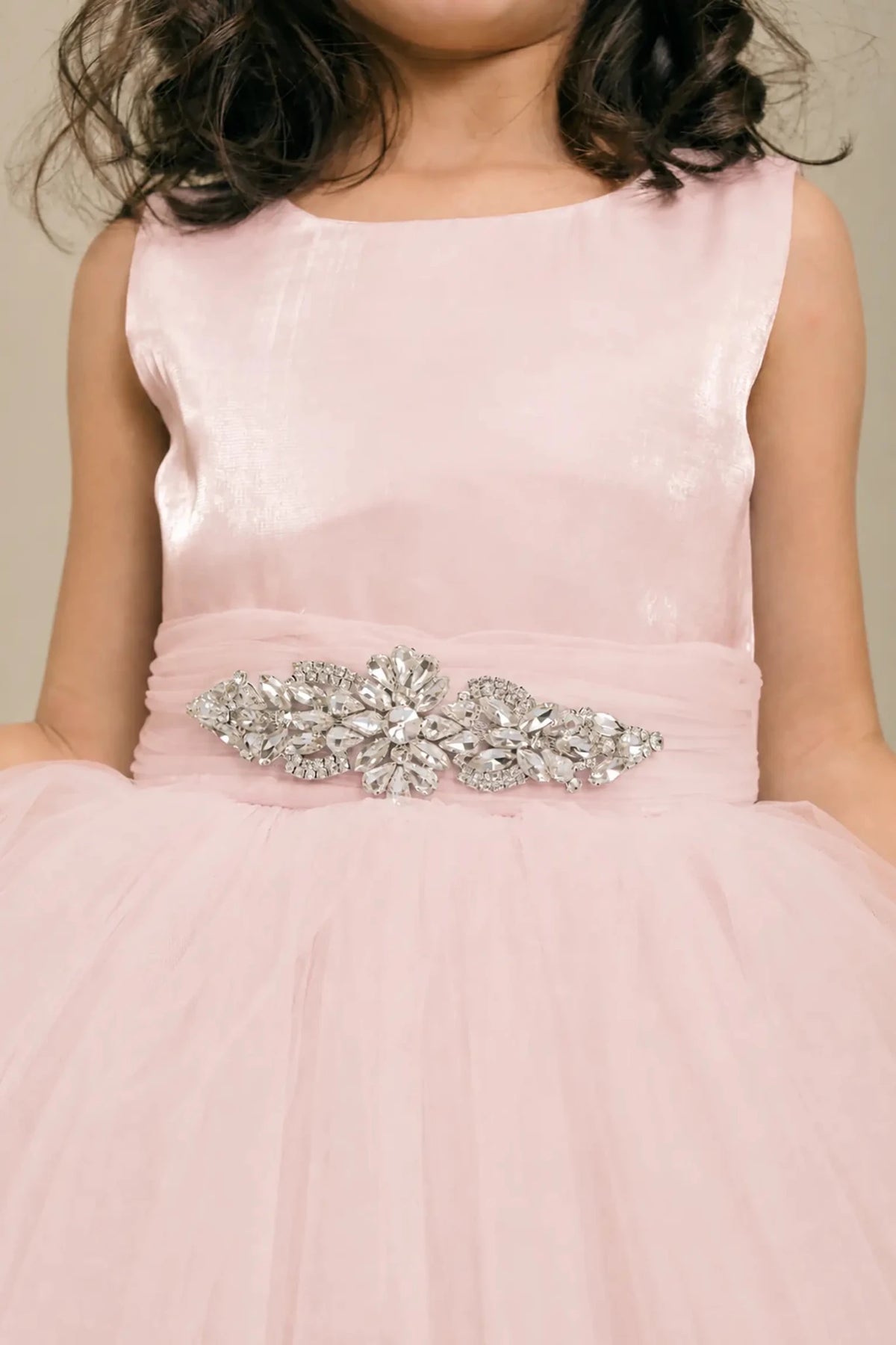 Blush flower girl dress with rhinestone waistband, satin bodice, and glitter tulle skirt.