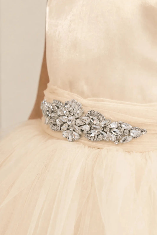 Champagne flower girl dress with rhinestone waistband, satin bodice, and glitter tulle skirt