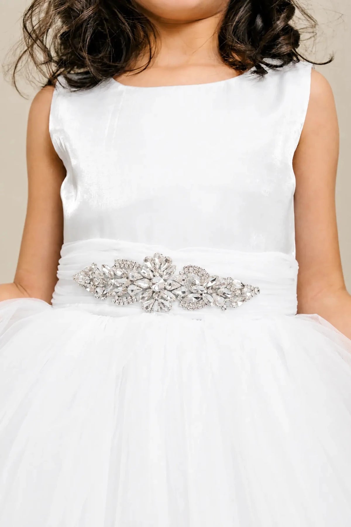 White flower girl dress with rhinestone waistband, satin bodice, and glitter tulle skirt.