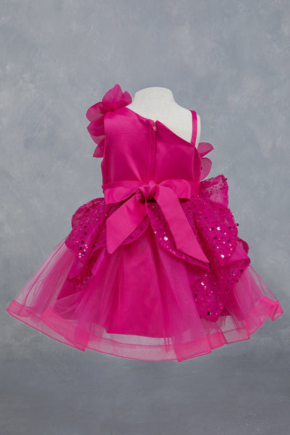 Fuchsia dress back view highlighting full skirt and elegant silhouette