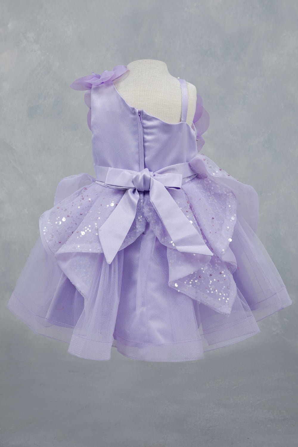 Lilac dress back view highlighting full skirt and elegant silhouette