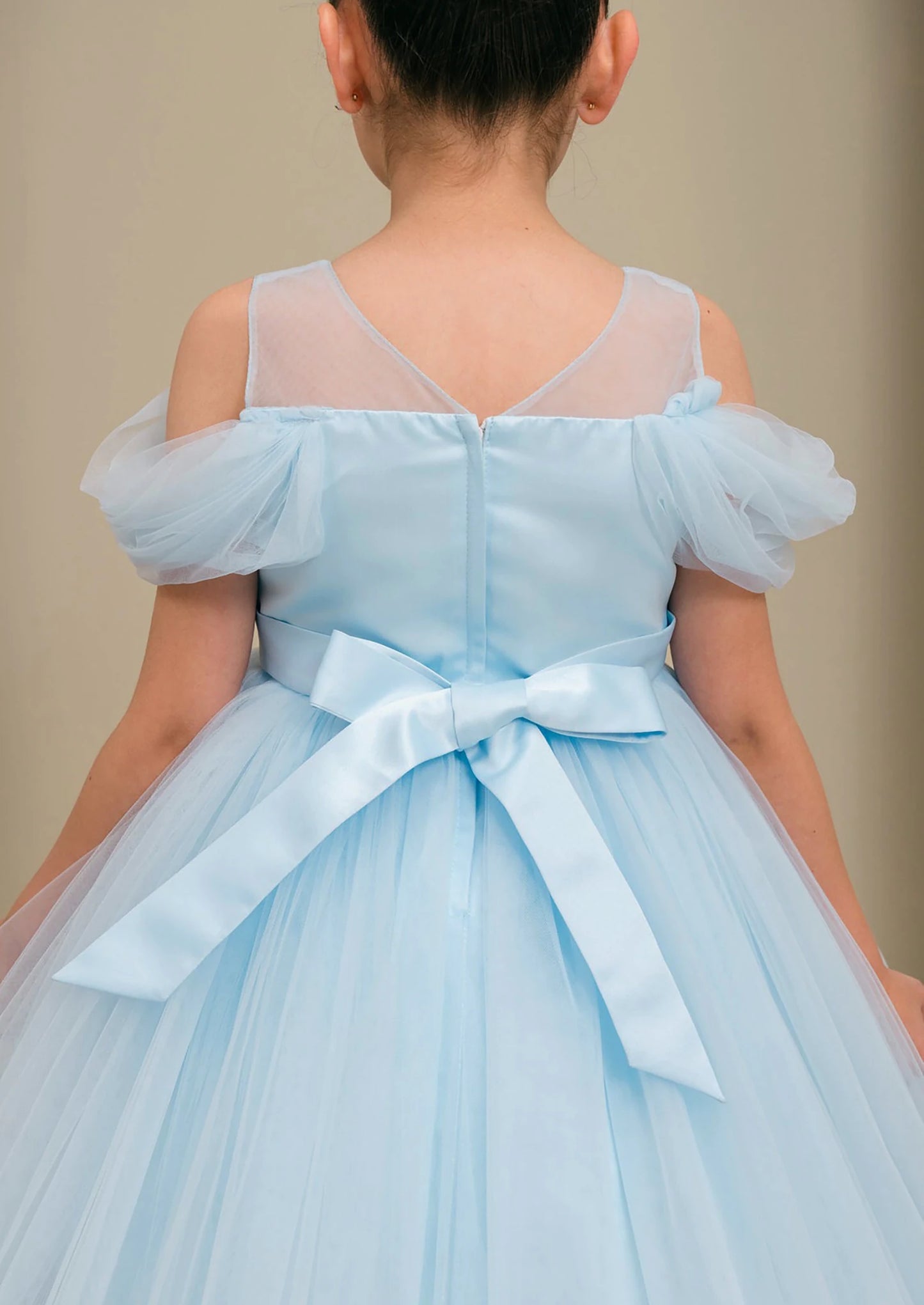 Light blue flower girl dress with a bow.