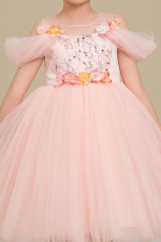 A pink tulle flower girl dress.