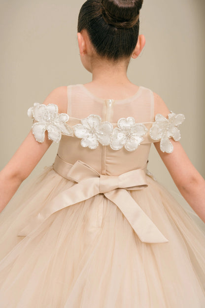 Notice the raised flowers around the sheer back neckline on this Champagne flower girl dress.