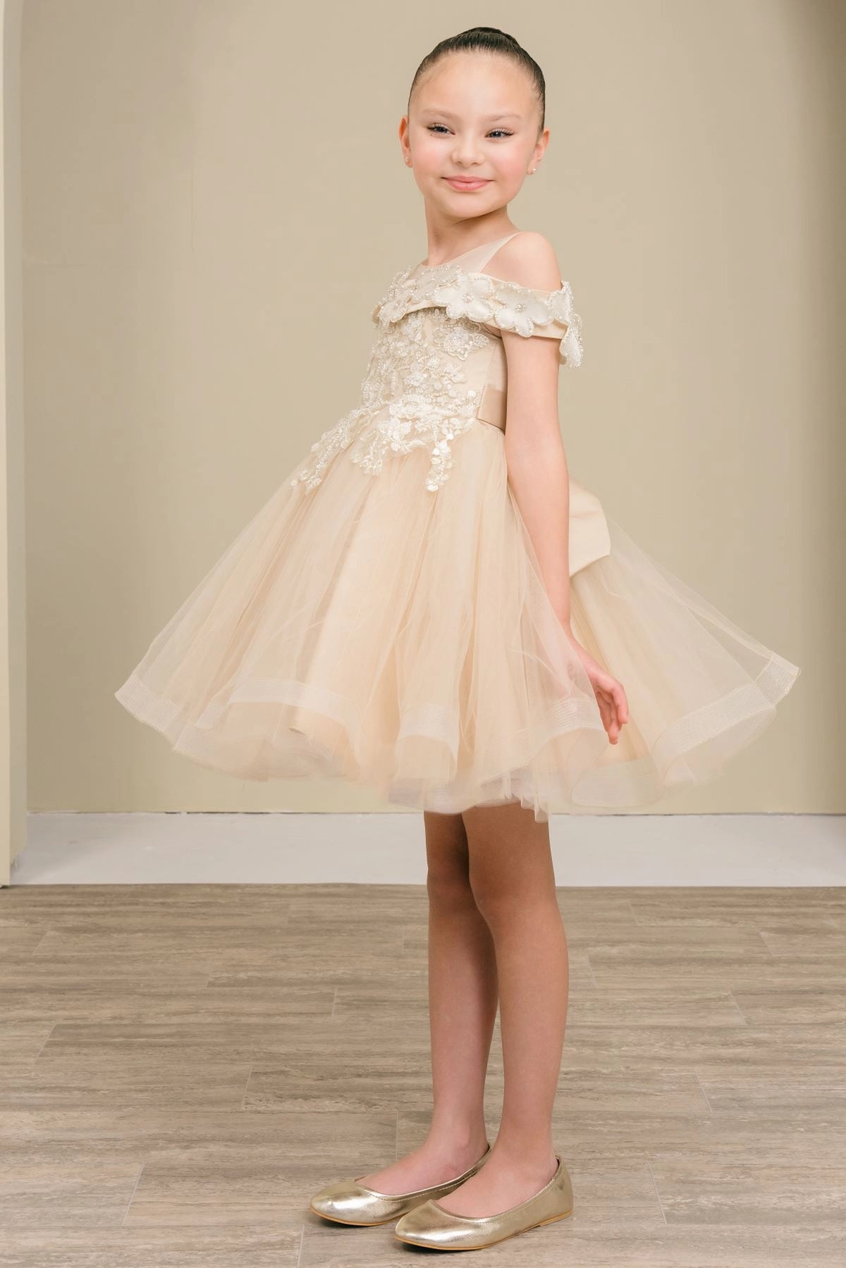 Featuring lace bodice above the flared tulle skirt on the Champagne flower girl dress.