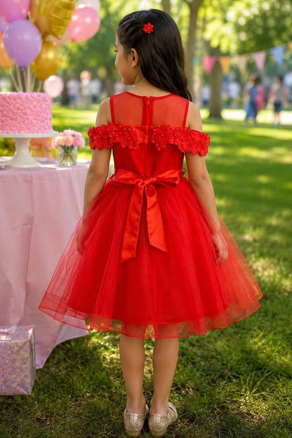 A Red flower girl dress showing satin bow below the sheer back yoke.