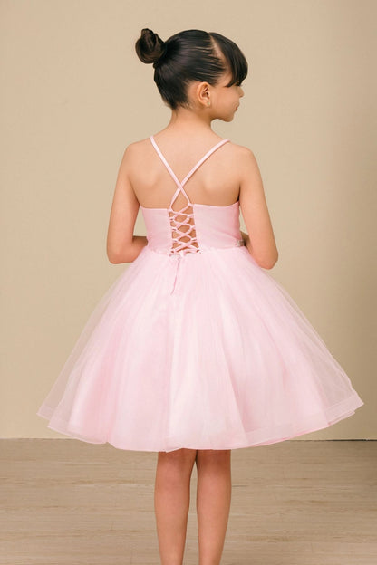 A Pink flower girl dress showing crossed straps and lace-up back.