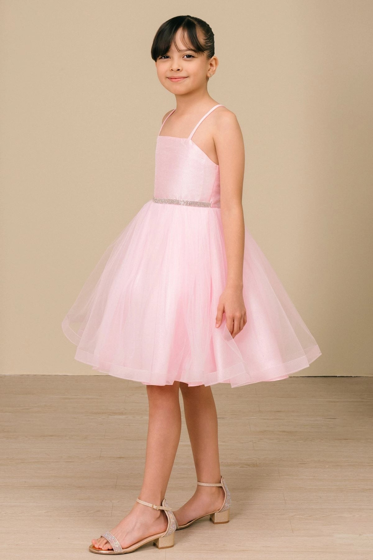 Featuring flared tulle skirt below the fitted bodice on the Pink flower girl dress.
